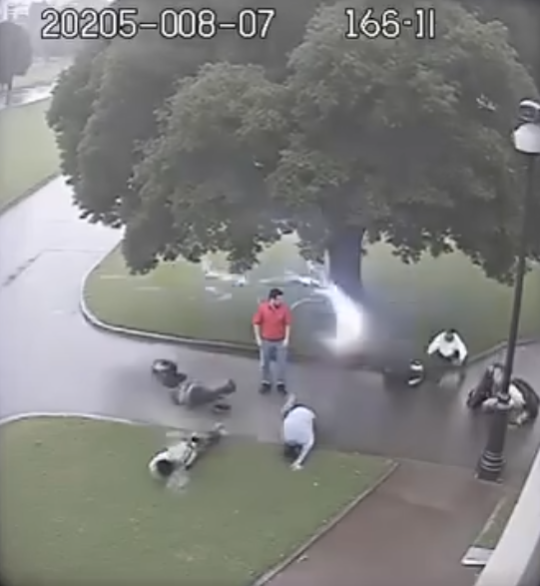 Four men sheltering under a tree in a Gurgaon park are struck by lightning, and all fall to the ground.